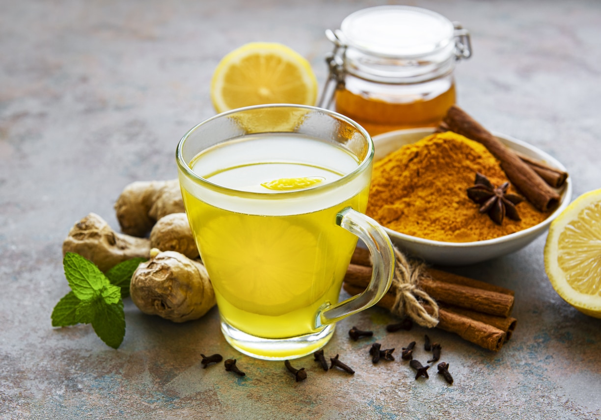 Turmeric tea surrounded by spices