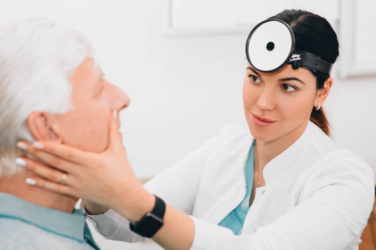Allergist examining an allergy patient evaluating if they need leukotriene modifiers.